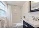 Cozy bathroom with modern vanity, mosaic tile floor, and shower-tub combo at 636 Cameron Street Se St, Atlanta, GA 30312