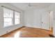 A bright bedroom featuring wood floors, white walls and modern window shades at 636 Cameron Street Se St, Atlanta, GA 30312