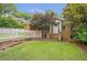 Cozy bungalow with a lush lawn and a charming white picket fence at 636 Cameron Street Se St, Atlanta, GA 30312