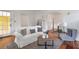 Inviting living room with hardwood floors, a comfortable white sofa, and plenty of natural light at 636 Cameron Street Se St, Atlanta, GA 30312