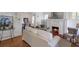 Cozy living room featuring a white-painted brick fireplace, hardwood floors, and elegant furnishings at 636 Cameron Street Se St, Atlanta, GA 30312