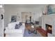 Open living room with fireplace flowing into dining area at 636 Cameron Street Se St, Atlanta, GA 30312