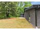 Exterior of home with lush greenery in the backyard at 998 Lookout Nw Ave, Atlanta, GA 30318