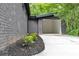 A large, empty garage with a brick exterior and concrete driveway at 998 Lookout Nw Ave, Atlanta, GA 30318