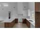 Modern kitchen featuring custom wood cabinets, white countertops, and stainless steel sink at 998 Lookout Nw Ave, Atlanta, GA 30318