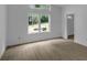 Well-lit living room area with wood floors, natural lighting, and a view of the outdoors at 998 Lookout Nw Ave, Atlanta, GA 30318