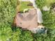 Aerial view of a beautiful home featuring a private pool and lush green surroundings at 10135 High Falls Pointe, Johns Creek, GA 30022