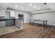 Open basement with a kitchenette, a bar area, and plenty of space for a ping pong table at 10135 High Falls Pointe, Johns Creek, GA 30022