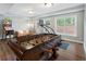 Fun basement rec room complete with a foosball table, pinball machine and treadmill at 10135 High Falls Pointe, Johns Creek, GA 30022