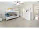 Spacious bedroom featuring a bunk bed, white walls, and a view into the hallway at 10135 High Falls Pointe, Johns Creek, GA 30022