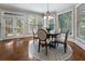 Bright breakfast nook features a round table, four chairs, and views of the outdoor deck at 10135 High Falls Pointe, Johns Creek, GA 30022
