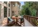 Wooden deck with outdoor dining set and green wooded backdrop, perfect for entertaining at 10135 High Falls Pointe, Johns Creek, GA 30022