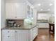 Kitchen area featuring custom cabinetry, granite counters, and stainless steel appliances at 10135 High Falls Pointe, Johns Creek, GA 30022