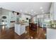 Spacious kitchen with granite countertops, a central island, and stainless steel appliances at 10135 High Falls Pointe, Johns Creek, GA 30022