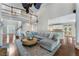 Spacious living room featuring an open floor plan, hardwood floors, and ample natural light at 10135 High Falls Pointe, Johns Creek, GA 30022