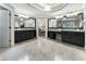 Main bathroom features double vanity, granite counters, travertine floors, and access to the main bedroom at 10135 High Falls Pointe, Johns Creek, GA 30022