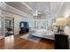 Spacious main bedroom features a trey ceiling, a ceiling fan, and an exterior balcony at 10135 High Falls Pointe, Johns Creek, GA 30022