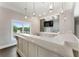 Spacious clubhouse wet bar with marble countertops and wood-look flooring at 10135 High Falls Pointe, Johns Creek, GA 30022
