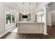 Clubhouse wet bar features a large window, TV, sink, and decorative backsplash at 10135 High Falls Pointe, Johns Creek, GA 30022