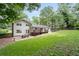 Expansive backyard features a patio with seating and a deck, perfect for outdoor entertaining in a serene setting at 2786 Georgian Ter, Marietta, GA 30068