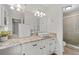 Bathroom featuring granite countertops, bright white cabinets, and modern fixtures at 2786 Georgian Ter, Marietta, GA 30068