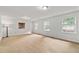 Spacious bedroom with neutral carpet, ample natural light from multiple windows, and a cozy ambiance at 2786 Georgian Ter, Marietta, GA 30068