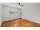Bright bedroom with hardwood floors, ceiling fan, and natural light from the window at 2786 Georgian Ter, Marietta, GA 30068