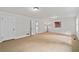 Bedroom with neutral carpet, white walls, and a bright, airy feel, offering a relaxing retreat at 2786 Georgian Ter, Marietta, GA 30068