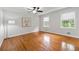 Bright bedroom with hardwood floors, large windows, and a ceiling fan, offering a comfortable space at 2786 Georgian Ter, Marietta, GA 30068