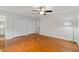 Bedroom featuring hardwood floors, white walls, and ample closet space, creating a tidy retreat at 2786 Georgian Ter, Marietta, GA 30068