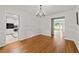 Well-lit dining room with hardwood floors, classic wainscoting, and easy access to the kitchen and living areas at 2786 Georgian Ter, Marietta, GA 30068