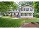 Charming two-story home with a well-maintained lawn and inviting curb appeal, surrounded by mature trees at 2786 Georgian Ter, Marietta, GA 30068