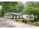 Charming home with a well-manicured lawn, a two-car garage, and beautiful landscaping enhances the curb appeal at 2786 Georgian Ter, Marietta, GA 30068