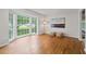 Bright living room featuring hardwood floors, a large bay window providing natural light, and neutral wall colors at 2786 Georgian Ter, Marietta, GA 30068