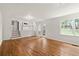 Spacious living area with hardwood floors, white walls, and access to the kitchen and outdoor spaces at 2786 Georgian Ter, Marietta, GA 30068
