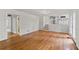 Open-concept living room with hardwood floors, white walls, and access to other areas of the home at 2786 Georgian Ter, Marietta, GA 30068