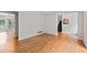 Open-concept living space with hardwood floors, neutral walls, and views into the foyer and dining area at 2786 Georgian Ter, Marietta, GA 30068
