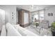 Welcoming living room with modern decor, brick accent wall, and sliding glass doors leading to the patio at 410 Concord St, Alpharetta, GA 30009
