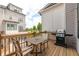 Cozy outdoor patio featuring wood deck, grill, and seating, perfect for outdoor dining and entertaining at 410 Concord St, Alpharetta, GA 30009