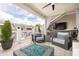 Relaxing outdoor patio equipped with comfortable seating, a stylish fire pit, and an outdoor television set at 410 Concord St, Alpharetta, GA 30009