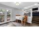 Cozy dining area with French doors, natural light, and a view of the living room at 5461 Forest Path Ct, Stone Mountain, GA 30088