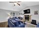 Cozy living room with a stone fireplace, vaulted ceilings, and comfortable seating area at 5461 Forest Path Ct, Stone Mountain, GA 30088