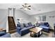 Bright living room featuring vaulted ceilings, hardwood floors, and comfortable seating arrangement at 5461 Forest Path Ct, Stone Mountain, GA 30088