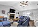 Inviting living room featuring vaulted ceilings, a stone fireplace, and comfortable seating at 5461 Forest Path Ct, Stone Mountain, GA 30088
