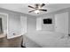 Cozy main bedroom is equipped with a ceiling fan, a tv, and a Primary bathroom with a tub-shower combo at 5461 Forest Path Ct, Stone Mountain, GA 30088