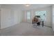 Bright bedroom with two windows bringing in natural light; neutral carpeting at 750 Summerstone Ln, Lawrenceville, GA 30044