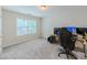 Carpeted bedroom with bright natural light, featuring a gaming setup at 750 Summerstone Ln, Lawrenceville, GA 30044