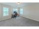 Bright bedroom with a work desk and two windows bringing in natural light at 750 Summerstone Ln, Lawrenceville, GA 30044