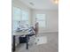 Comfortable bedroom featuring two windows bringing in natural light and a work desk at 750 Summerstone Ln, Lawrenceville, GA 30044