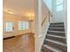 Inviting foyer featuring hardwood floors, stairs to the second floor, and a formal dining room with wainscoting at 750 Summerstone Ln, Lawrenceville, GA 30044